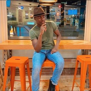 Brown Fedora hat with black belt around it